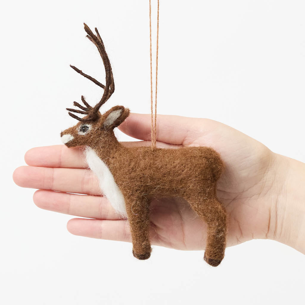 Soft, fuzzy, and full of woodland wonder, our Fuzzy Reindeer Ornament captures the quiet magic of the holiday season. With its beautiful tall antlers, sweet expression, and irresistibly fluffy coat, this darling little reindeer looks as though it has wandered straight out of an enchanted winter forest.