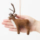 Soft, fuzzy, and full of woodland wonder, our Fuzzy Reindeer Ornament captures the quiet magic of the holiday season. With its beautiful tall antlers, sweet expression, and irresistibly fluffy coat, this darling little reindeer looks as though it has wandered straight out of an enchanted winter forest.