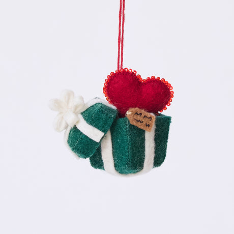Craftspring’s Gift from the Heart Ornament — felt ornament of a heart coming out of a present, with intricate beaded and embroidered details including a gift tag — heirloom-quality Christmas decor, perfect for holiday gifting, ethically crafted by artisans using sustainable wool.