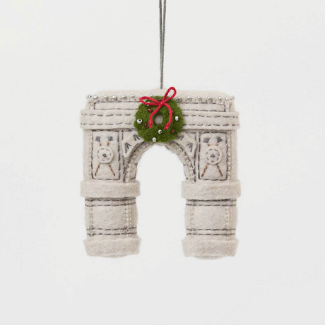  Our Grand Arch Ornament captures that timeless landmark, beautifully adorned with a festive holiday wreath for an extra touch of seasonal cheer.

Carefully handcrafted with embroidered architectural details, sculptural felt columns, delicate bead accents, and a miniature wreath tied with a bright red bow, this ornament celebrates both the elegance of the famous arch and the magic of Christmas in New York. 
