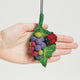 Handcrafted needle-felted wool ornament featuring a red ladybug perched on a textured green grape leaf, accented with a cluster of purple felt grapes—ready to hang