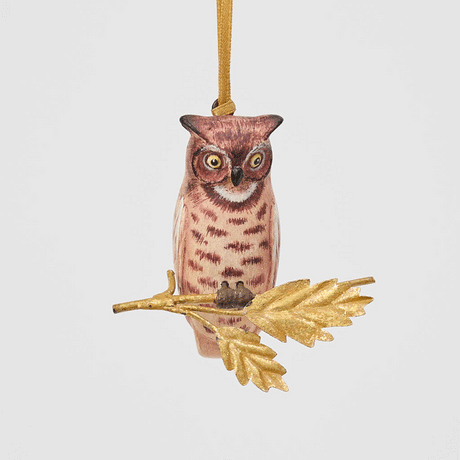 A vintage-inspired Great Horned Owl Resin Ornament, hand-painted in the Philippines and perched on a golden metal oak branch with sculpted leaves.