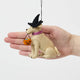 A handmade felt Halloween Lab Ornament featuring a Labrador retriever dressed in a witch hat and carrying a tiny jack-o’-lantern trick-or-treat bucket.