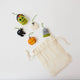 A handmade felt Halloween Mini Ornaments Set featuring five tiny spooky-season favorites: a black cat, candy-filled monster bucket, ghost, jack-o’-lantern, and RIP tombstone.