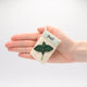 Felt seed packet ornaments featuring basil, chives, and rosemary with garden-inspired details