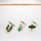 Set of three felt herb ornaments styled like seed packets—eco-friendly and handcrafted