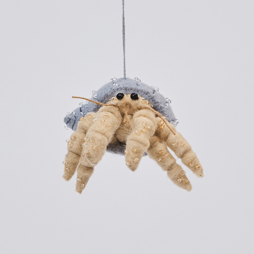 Handmade felt Hermit Crab ornament from Craftspring rotating to show front, side, and back views—highlighting detailed beading and embroidery on the shell and legs, showcasing heirloom craftsmanship, ethically crafted by artisans using sustainable wool.