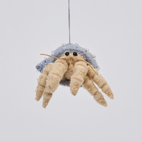 Handmade felt Hermit Crab ornament from Craftspring rotating to show front, side, and back views—highlighting detailed beading and embroidery on the shell and legs, showcasing heirloom craftsmanship, ethically crafted by artisans using sustainable wool.