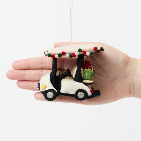 Our Holiday Golf Cart Ornament is ready to roll into the season with tropical flair! Decorated with a cheerful red, green, and white garland around the roof and carrying tiny wrapped presents in the back, this festive golf cart is the perfect ride for Christmas in paradise.