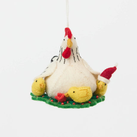 Gathered together on a festive green wreath our Holiday Hen with Chicks Ornament is a sweet celebration of family, nurturing, and holiday togetherness. A proud mother hen watches over her fluffy yellow chicks, while one festive little chick sports a tiny red Santa hat, adding an extra dash of Christmas cheer. 