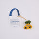 Craftspring’s Holiday Taxi Bag Charm — handmade felt taxi with a beautifully beaded Christmas tree on top, crafted by women artisans in Kyrgyzstan using locally sourced wool — heirloom-quality holiday accessory, perfect for Christmas gifting, ethically crafted by artisans using sustainable wool.