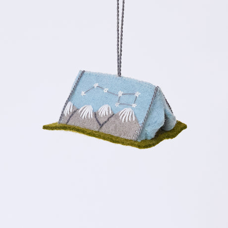 Handmade felt Home Under the Stars Tent ornament from Craftspring, featuring applique and embroidered mountains with the Big Dipper on the side and a mini felt mattress inside the tent—heirloom-quality Christmas decor, ethically crafted by artisans using sustainable wool.
