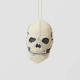 A handmade felted and embroidered Human Skull Ornament featuring embroidered bone, teeth, and crack details for a delightfully spooky addition to Halloween décor.