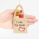 Handmade felt ornament shaped like a tote bag filled with miniature felt books, including titles like Pride & Prejudice and War & Peace. Crafted from soft merino-blended wool, this quirky ornament is a playful nod to literary humor. Perfect for bookworms, teachers, librarians, and pun enthusiasts, it adds a clever touch to holiday trees, bookshelves, or classrooms. Ready to hang with a string attached. Scale sizing reference