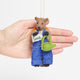 Eco-friendly wool woodchuck ornament dressed for gardening with embroidered details