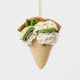 Capture the sweet taste of the Florida Keys with our handcrafted Key Lime Pie Slice Felt Ornament, a delightful dessert-inspired decoration featuring fluffy whipped cream, vibrant lime accents, and realistic pie slice details. Handmade from sustainable wool felt by women artisans, this whimsical ornament celebrates one of America's most beloved tropical desserts and adds a playful touch to holiday décor.
