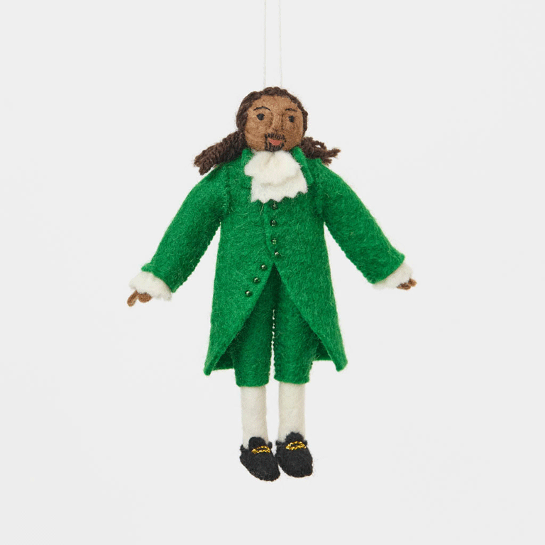 Celebrate the cultural phenomenon that brought Revolutionary history to a new generation with our handcrafted Lin-Manuel Miranda as Hamilton Ornament. Inspired by his iconic portrayal of Alexander Hamilton, this felt ornament captures the energy, creativity, and theatrical spirit of a groundbreaking American story.