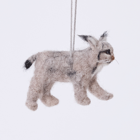 Handmade felt Lynx ornament from Craftspring rotating to show front, side, and back views — realistic needle-felted details with whiskers, ear tufts, and a lifelike face, ethically crafted by artisans using sustainable wool.