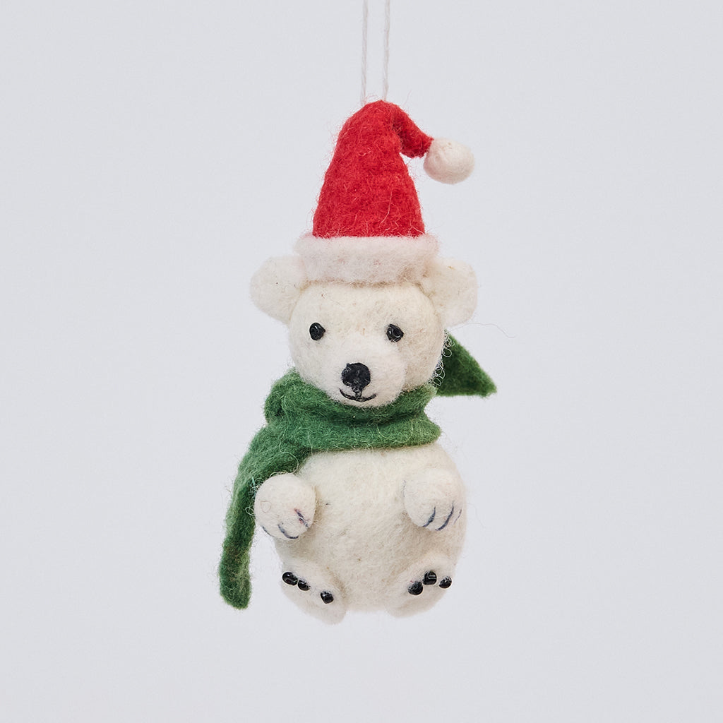 Handmade felt Little Drop Polar Bear ornament from Craftspring, featuring a polar bear wearing a Santa hat and green scarf—heirloom-quality Christmas decor perfect for festive gifting, ethically crafted by artisans using sustainable wool.