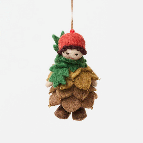Waldorf-inspired, our Little Pinecone Kid Ornament captures the whimsical spirit of a woodland fairy tale. With its cute woolen bonnet, it's pine-green scarf and lovely layered pinecone petals and sweet as can be felted booties - this pinecone child is ready to capture woodland hearts.