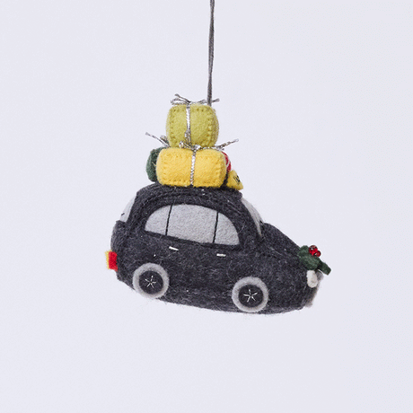 Handmade felt London Black Cab ornament from Craftspring rotating to show front, side, and back views—featuring beaded and embroidered details with festive presents on top of the car and holly accents, ethically crafted by artisans using sustainable wool.