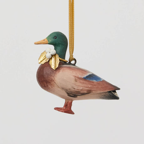 A vintage-inspired Mallard Duck Resin Ornament, hand-painted in the Philippines with a golden metal holly necklace and satin hanging ribbon.