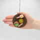Handmade felt ornament honoring Japanese matcha tea ceremony with embroidered matcha bowl, chasen, and spoon. Ethically made and fair trade.