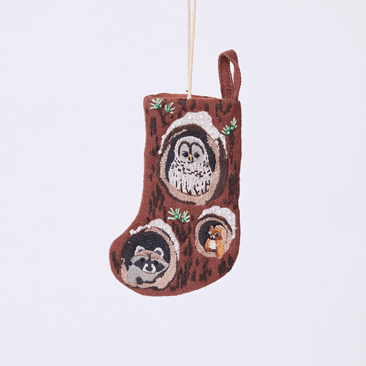 Handmade linen Woodland Mini Stocking ornament from Craftspring rotating to show front, side, and back views—featuring intricate beaded and embroidered details with animals peeking out of holes in a tree, including an owl, raccoon, and squirrel, ethically crafted by artisans using sustainable materials.