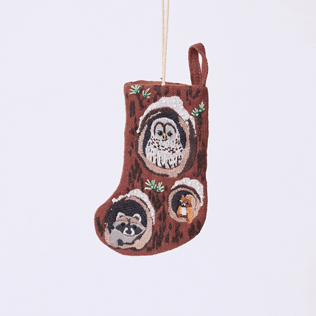 Handmade linen Woodland Mini Stocking ornament from Craftspring rotating to show front, side, and back views—featuring intricate beaded and embroidered details with animals peeking out of holes in a tree, including an owl, raccoon, and squirrel, ethically crafted by artisans using sustainable materials.