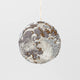 Beaded linen moon ornament with embroidered lunar surface and phases.

