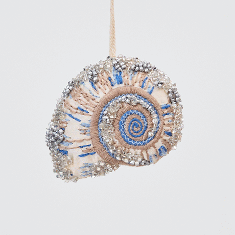 Craftspring’s Moon Snail Shell Ornament rotating to show front, side, and back views — made of satin with intricate beaded and embroidered details, ethically crafted by artisans.
