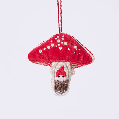 Handmade satin and velvet Mushroom Beaded Ornament from Craftspring, featuring intricate beaded and embroidered details with a gnome peeking out of a door on one side of the mushroom—heirloom-quality Christmas decor, ethically crafted by artisans using sustainable materials.