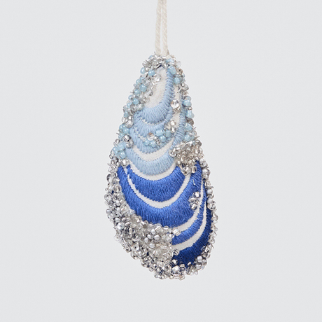 Craftspring’s Mussel Shell Ornament rotating to show front, side, and back views — made of satin with intricate beaded and embroidered details, ethically crafted by artisans.