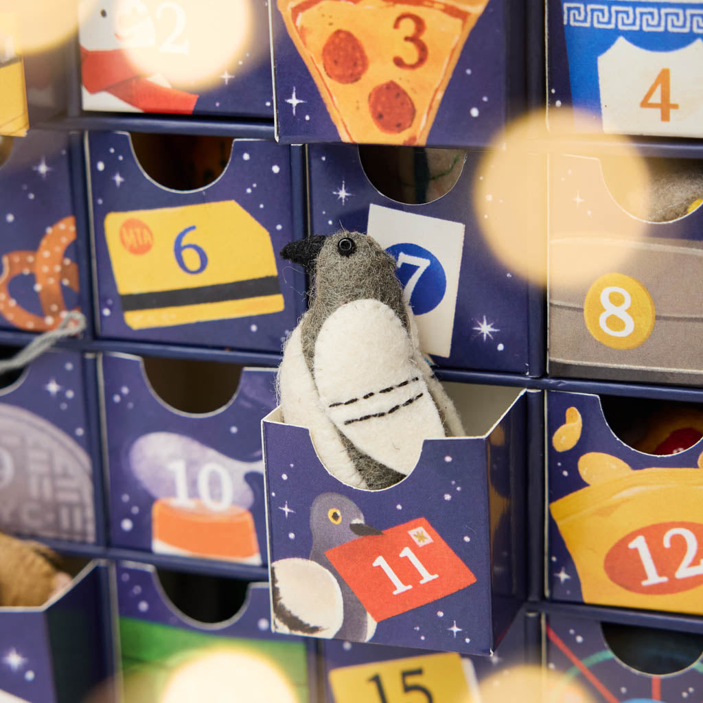 Advent Detail - Countdown to Holiday Magic in iconic style, with our handmade New York City Advent calendar featuring 24 miniature felt ornaments inspired by the landmarks, foods, neighborhoods, and wonderfully quirky icons of NYC.