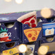 Close of NYC Advent Calendar -Countdown to Holiday Magic in iconic style, with our handmade New York City Advent calendar featuring 24 miniature felt ornaments inspired by the landmarks, foods, neighborhoods, and wonderfully quirky icons of NYC.