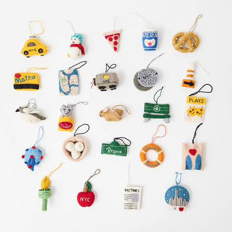 Christmas in New York, one tiny surprise at a time! Our NYC Advent Calendar turns the countdown to Christmas into a love letter to the city that never sleeps. Open a little numbered drawer each day to discover one of 24 handmade mini ornaments, each celebrating a piece of New York life.