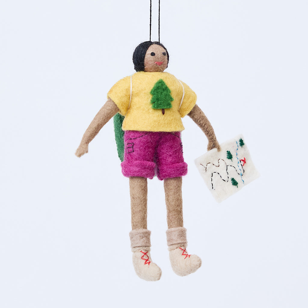 Handmade felt On the Trail Backpacker Ornament – Brown from Craftspring, featuring a backpacker girl holding a map and wearing colorful hiking clothes—heirloom-quality Christmas decor, perfect for holiday gifting, ethically handcrafted by artisans using sustainable wool.