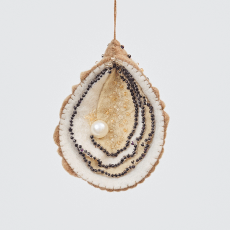 Spinning view of Craftspring’s handmade felt Oyster Christmas ornament, with a shimmering beaded pearl and intricate beaded and embroidered details—heirloom-quality holiday decor, sustainably made by artisans.