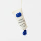 Add a splash of creativity to your holiday décor with our handcrafted Paint Tube Ornament. Designed for artists, makers, and color lovers, this charming felt ornament captures the playful essence of a classic paint tube—complete with a vibrant blue “paint” drop detail. On the back, intricate embroidery mimics a real paint label—complete with ‘Primary Blue #287’ markings and barcode-style details—adding an extra layer of realism and handcrafted charm.