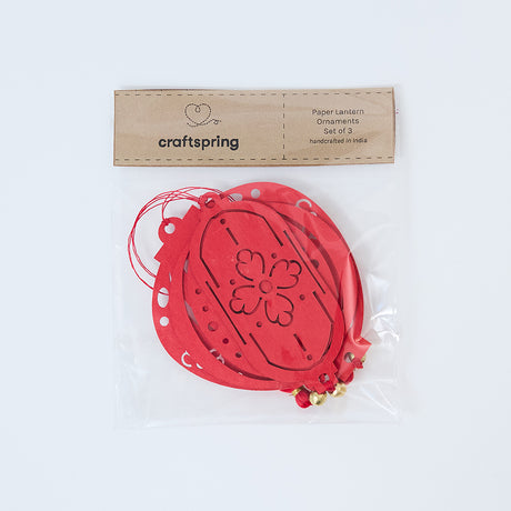 Paper Lantern Ornaments displayed inside their clear bag packaging, showing the delicate cutout details and festive Lunar New Year presentation.