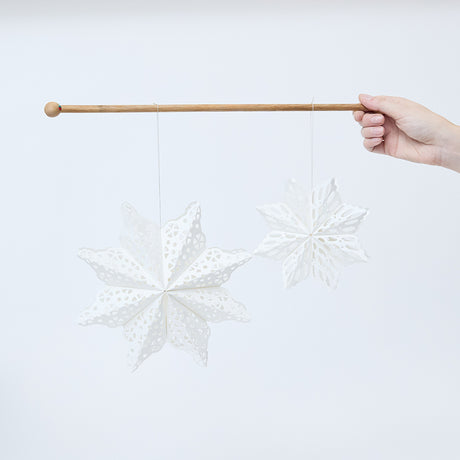 Craftspring’s Paper Snowflakes Christmas Ornaments — Set of 2, large white snowflakes with intricate cutout patterns, one slightly larger than the other —  ethically handmade by artisans from recycled cotton waste.
