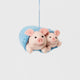 Cozy, cuddly, and completely irresistible—our Pigs in a Blanket Ornament is here to wrap your holidays in pure joy. Featuring a sweet pig parent and baby snuggled snugly inside a soft blue “blanket,” this playful design brings together comfort, humor, and heartfelt connection in the most delightful way.