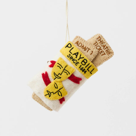 Celebrate the magic of Broadway with our handmade Playbill Ornament, inspired by the iconic theater program and finished with a hidden "Bravo!" message to honor every unforgettable performance.