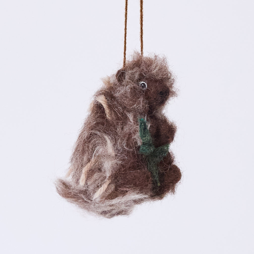 Handmade felt Porcupine ornament from Craftspring, needle-felted with a sweet face, fuzzy quills, and a leafy branch — heirloom-quality Christmas decor, ethically crafted by artisans using sustainable wool.