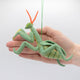 Nature-inspired Praying Mantis ornament handmade from wool with bead eyes and stitched details