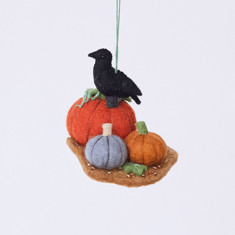 Handmade felt Pumpkin Patch ornament from Craftspring rotating to show front, side, and back views—featuring three pumpkins in different colors with a crow perched on top, with intricate beaded and embroidered details, ethically crafted by artisans using sustainable wool.