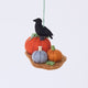 Handmade felt Pumpkin Patch ornament from Craftspring, featuring three pumpkins in different colors with a crow perched on top, with intricate beaded and embroidered details—heirloom-quality Halloween and autumn harvest decor, ethically crafted by artisans using sustainable wool.