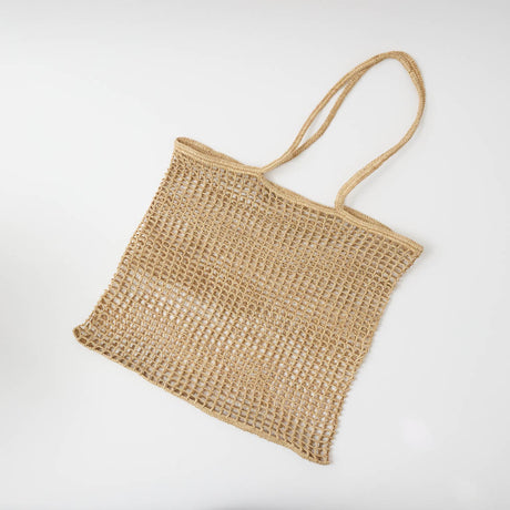 Effortlessly stylish and endlessly versatile, our Raffia Tote Bag is designed for beach days, market strolls, weekend getaways, and everyday adventures. Hand-crocheted from natural raffia fibers, this lightweight tote combines timeless coastal style with practical functionality, creating a beautiful accessory you'll reach for season after season.