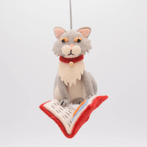 Handmade gray felted cat ornament, depicted mid-chapter in a fishy tale. The playful kitty wears a jingly collar and is fully immersed in its literary adventure. Crafted from natural wool, this whimsical ornament celebrates the love of books and cats, perfect for cat lovers, readers, and bookshop fans. Comes ready to hang with a string, adding a charming touch to any tree or reading nook. GIF 360 degree view