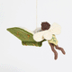 Handmade felt ornament of a fairy with delicate wings and a leafy green tunic, reading an oversized open book embroidered with whimsical details. Crafted from merino-blended wool, this limited-edition ornament is full of storybook charm. Perfect for fairy collectors, book lovers, and dreamers, it brings a magical, literary touch to bookshelves, holiday trees, or cozy reading spaces. Ready to hang with a string attached. GIF 360 degree view